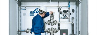 Worker is checking the Installation, Equipment for Flowtrain (control cabinet).