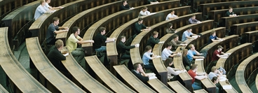 Students sitting in a lecture hall.